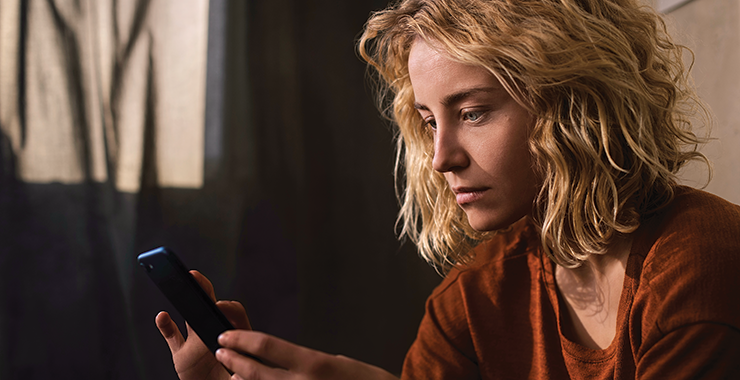 woman looking at a smartphone screen