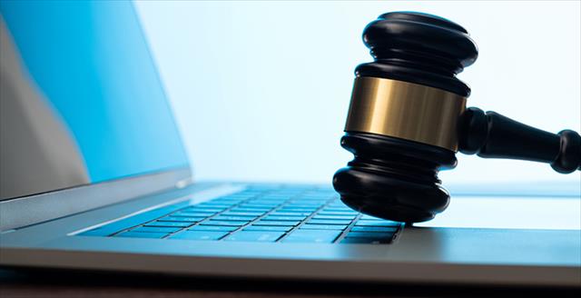 gavel on a laptop keyboard