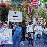 protestors with signs against vaccination