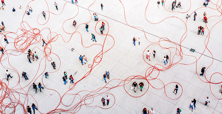 graphic depicting people walking around with string wound through the crowd