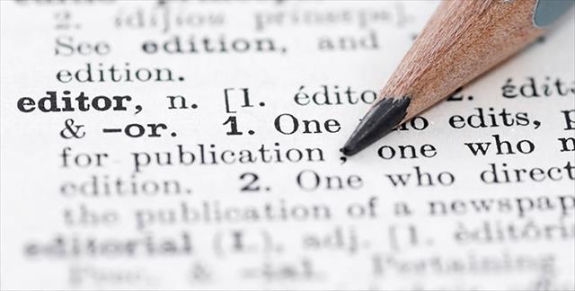 pencil pointing at the word Editor in the dictionary