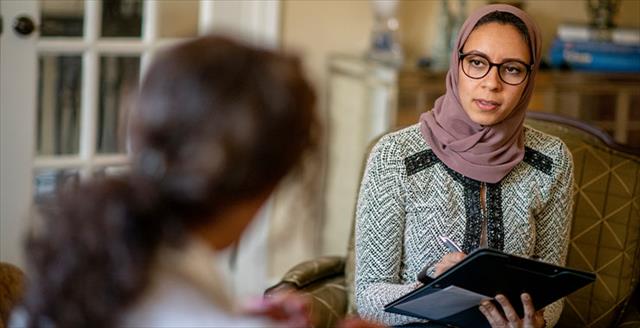 A professional talking to a client or patient