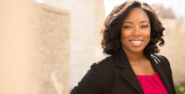 Woman in dark jacket smiling