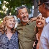 Group of happy senior friends sharing a moment outdoors