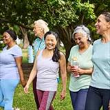 diverse group of women walking in a park