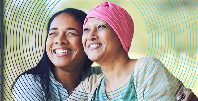 LBGTQ couple, one of whom is bald from cancer treatments