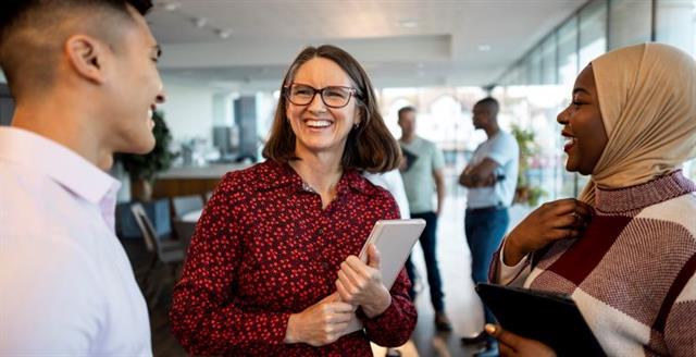 Students chat with professor