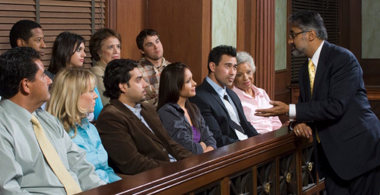 A lawyer talks to a jury in court