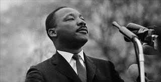 Martin Luther King Jr. standinf at podium