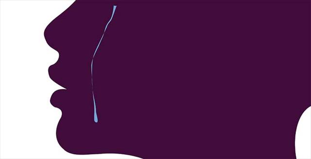 Minimalist silhouette of a woman face. A tear falling on the cheek.