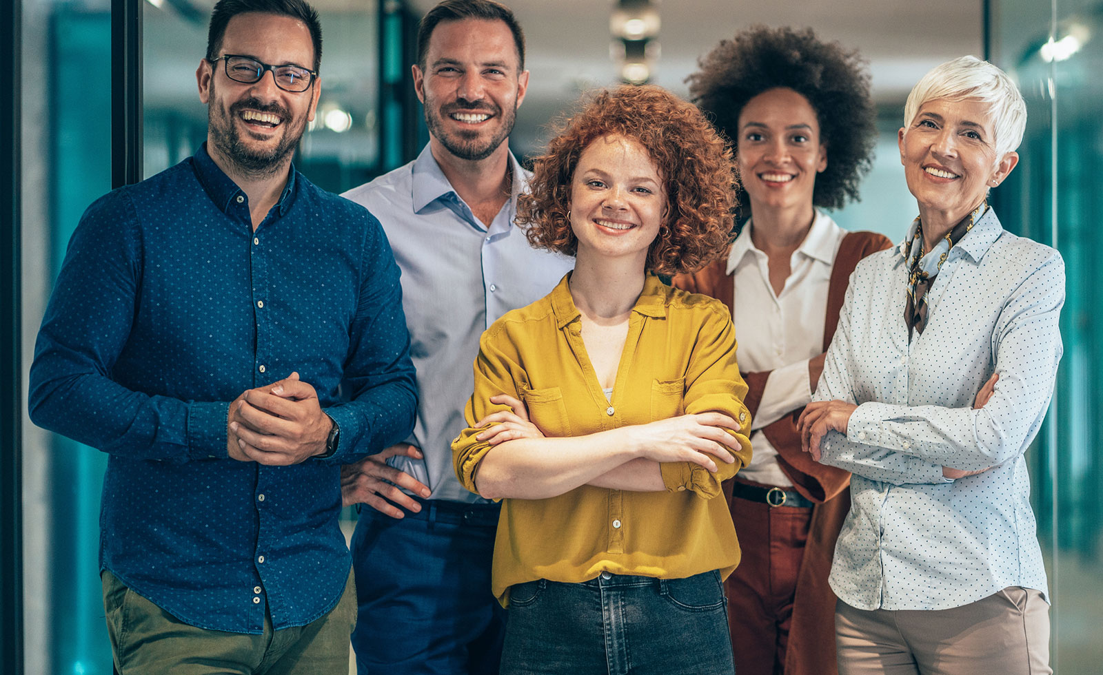 Group of co-workers smiling at the camera.