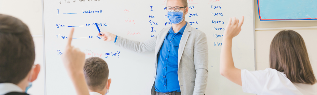 Instructor pointing at board