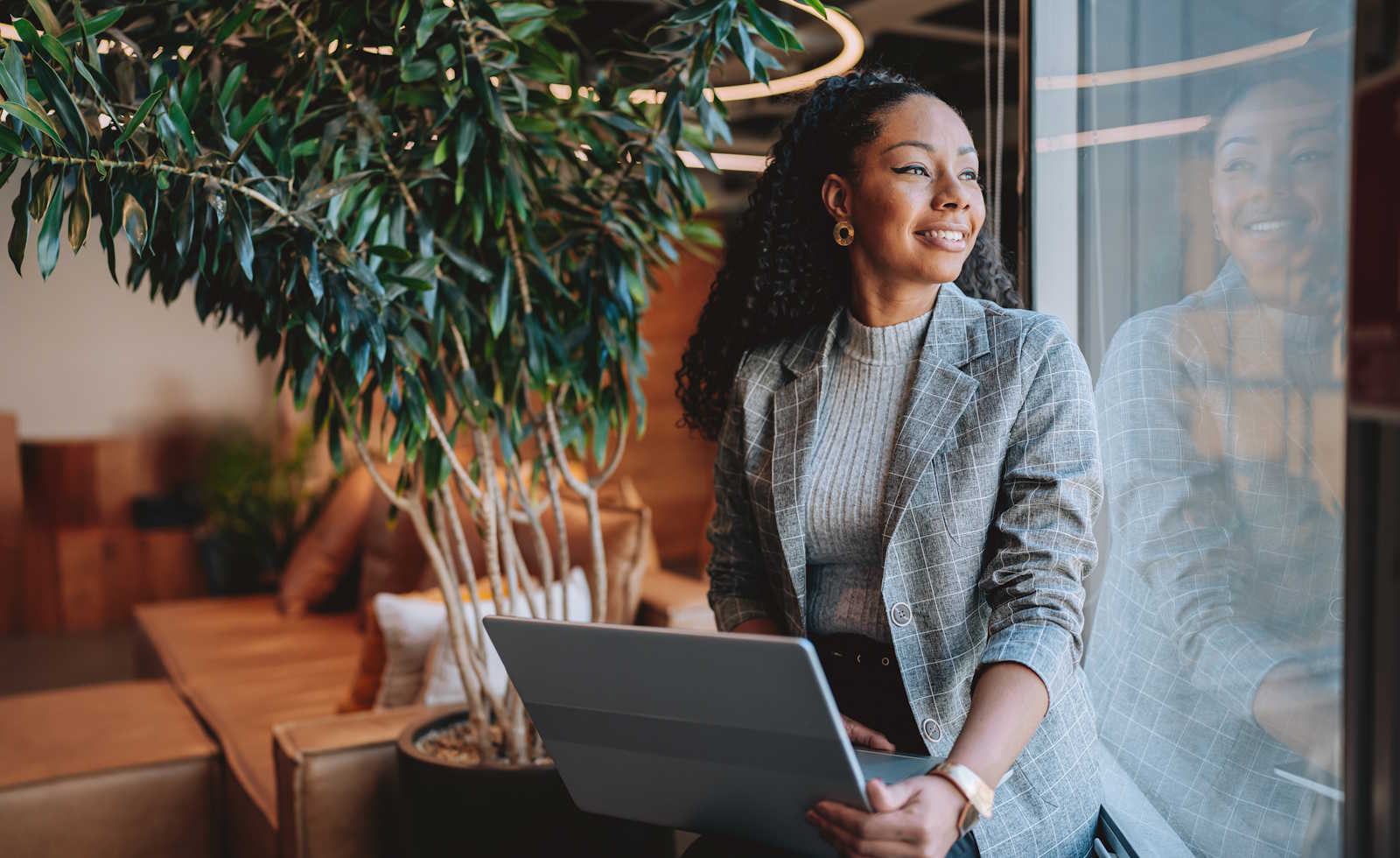 woman seated with an open laptop